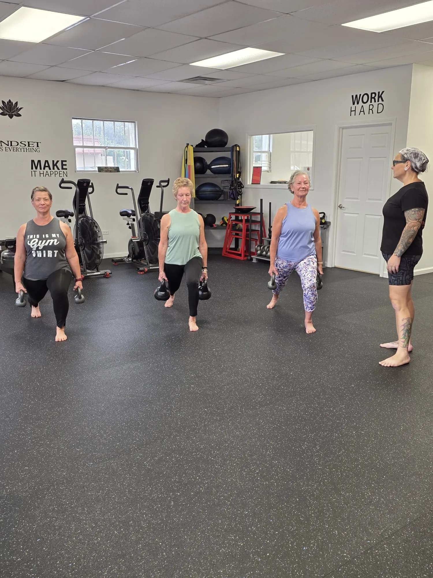 Aviva Mitchell coaching members through kettlebell work at VivaHealth Studio