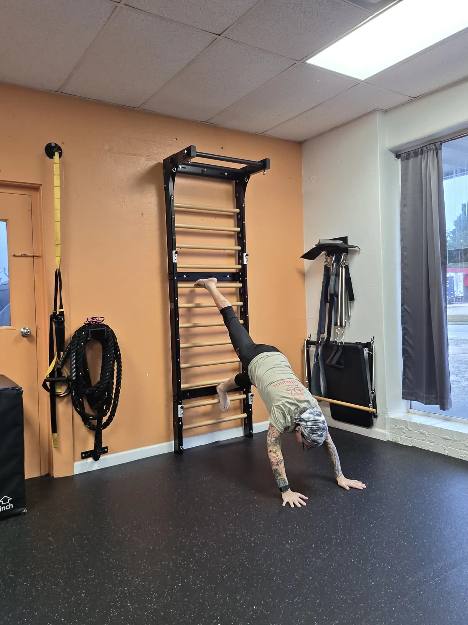 Aviva Mitchell training on the stall bars at VivaHealth Studio