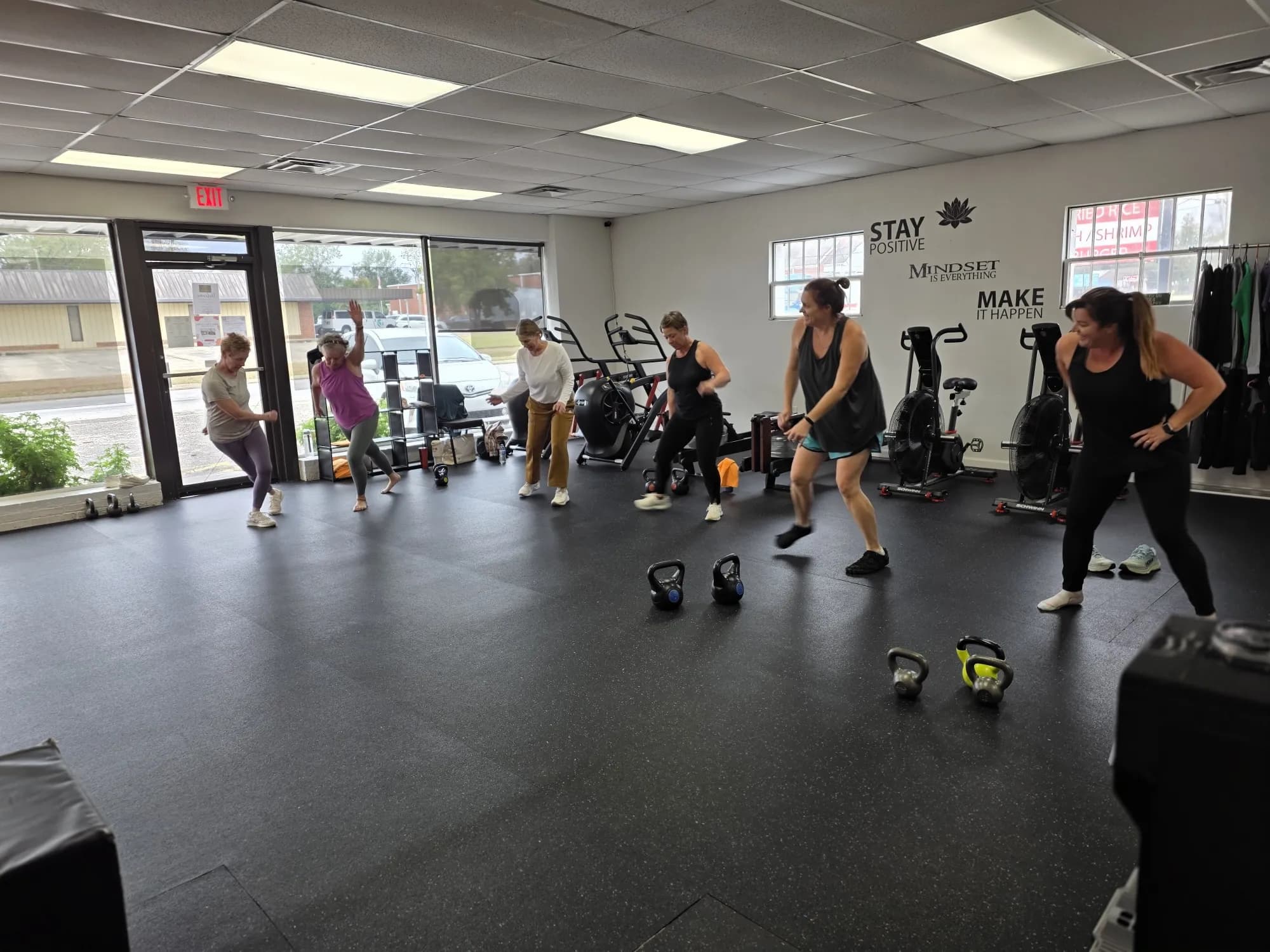 A group fitness class training with kettlebells at VivaHealth Studio