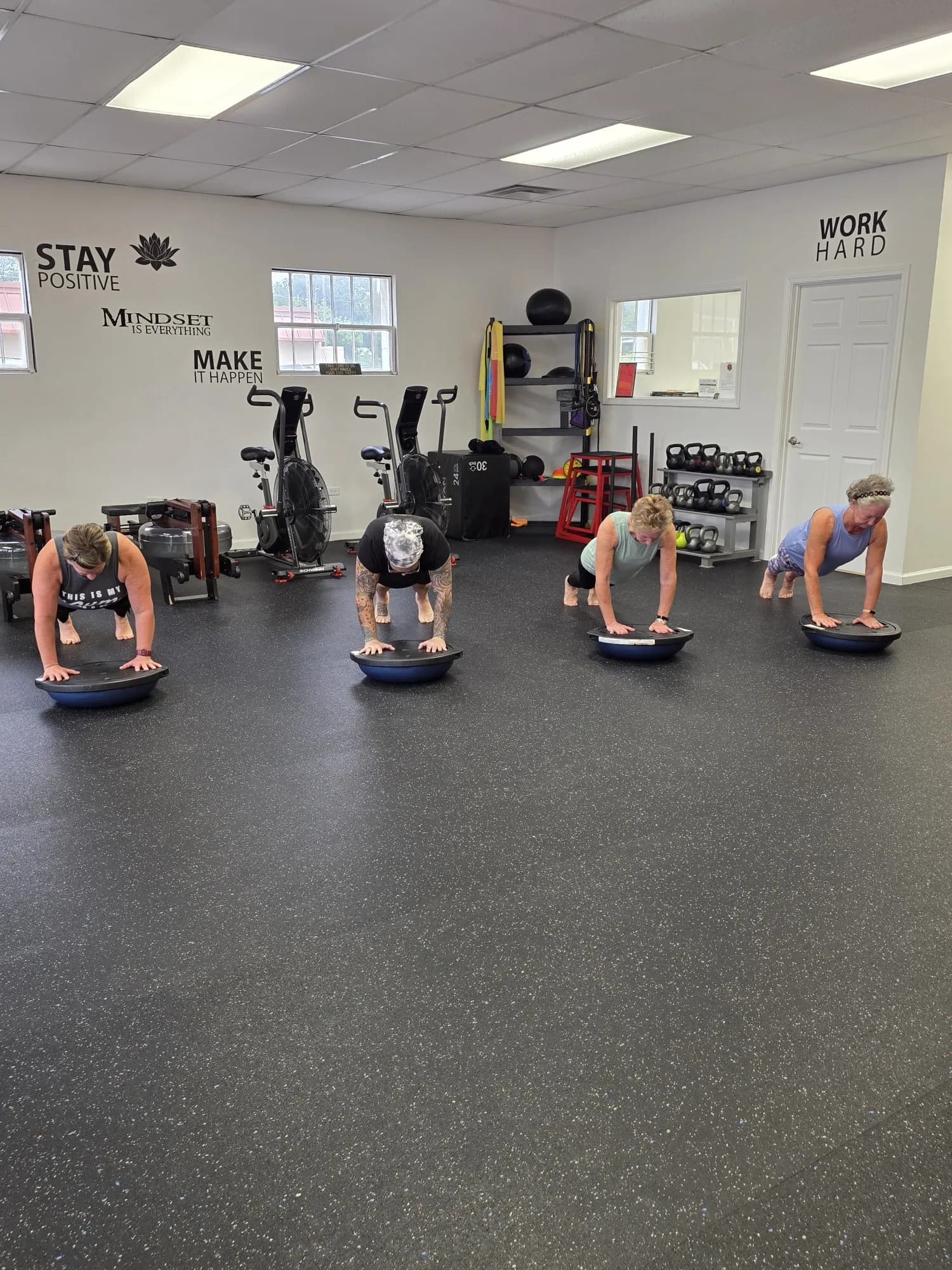 Aviva Mitchell coaching a plank series during group fitness